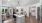 a kitchen with a bar and chairs