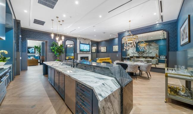 a kitchen with a bar and a large island