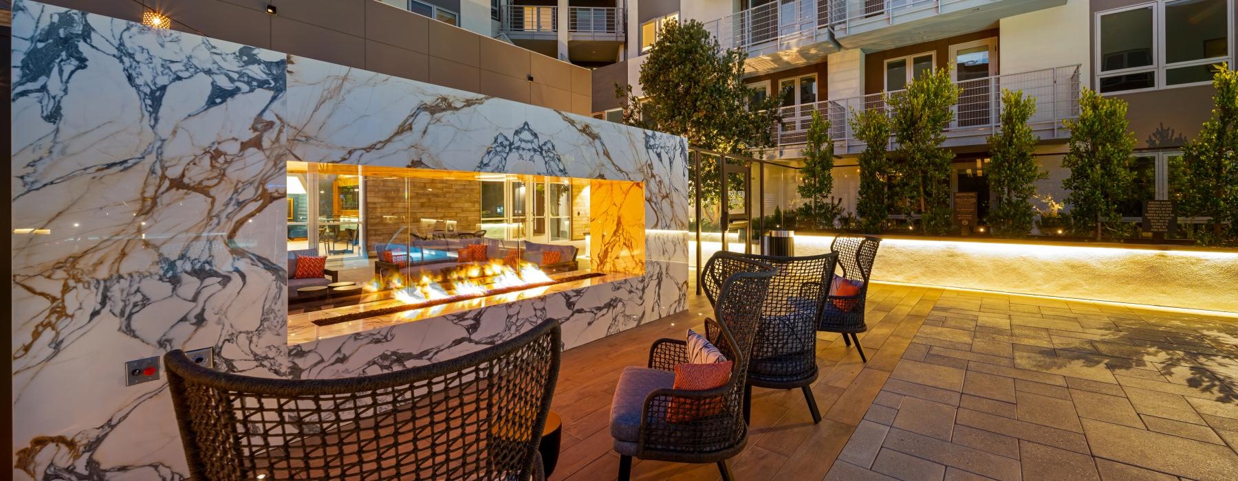 a patio with chairs and a table